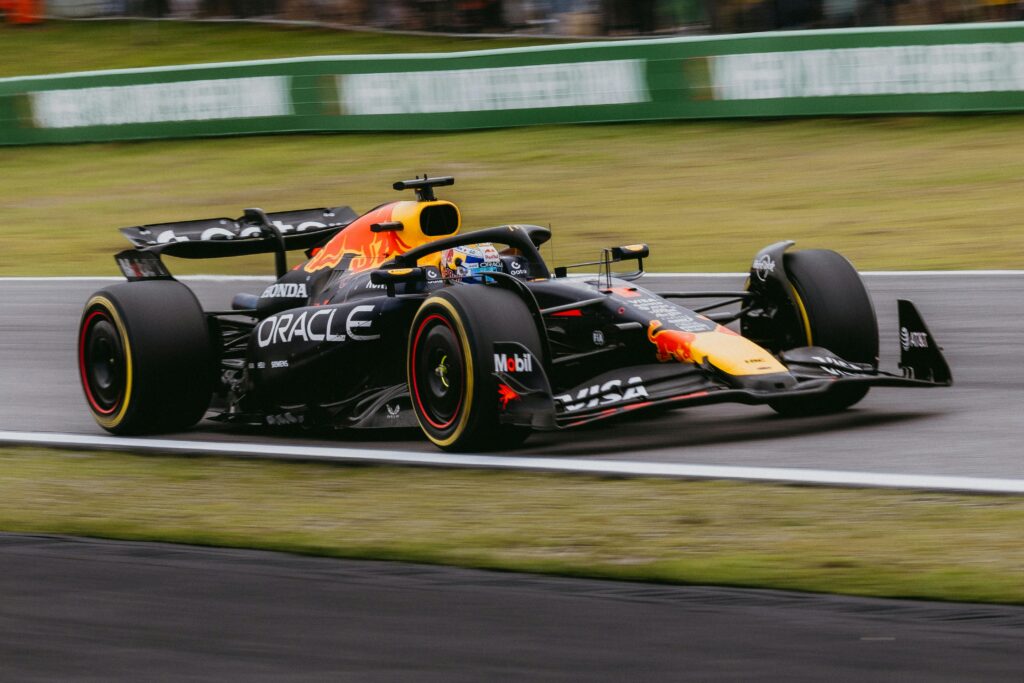 Dynamic shot of a Formula 1 race car speeding at the Interlagos track in São Paulo, Brazil.